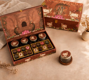 The Premium Shrinathji Luxury Gift Hamper Box is specially designed for premium festive and traditional gifting. Its elegant Shrinathji artwork and luxurious presentation make it ideal for gifting to family, friends, business associates, and loved ones during Diwali, housewarming ceremonies, weddings, pooja celebrations, festivals, and other special occasions. With 4 premium glass jars and 16 handcrafted chocolates, it offers a thoughtful combination of tradition, luxury, and indulgence—making the gift feel truly special from the moment it is presented.